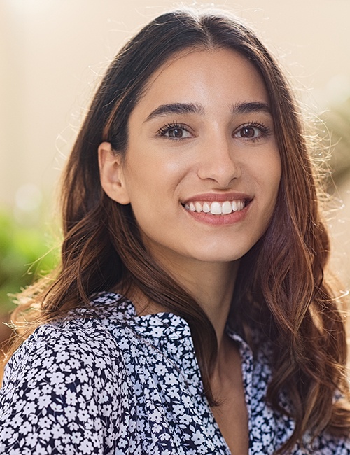 Woman smiling after visiting our bilingual dental team