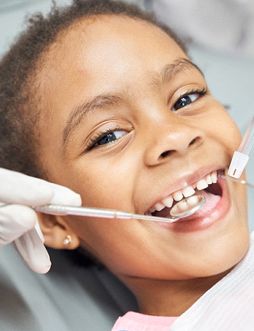 Closeup of child smiling during dental checkup