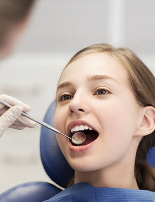 An up-close view of a little girl having her teeth cleaned by her dentist in Copperas Cove