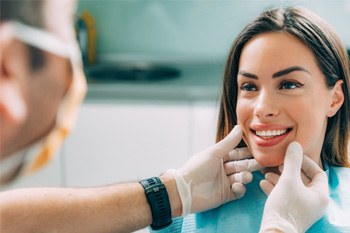 a patient smiling after undergoing cosmetic dentistry 