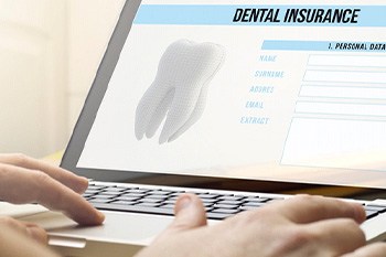Dental insurance information on laptop screen