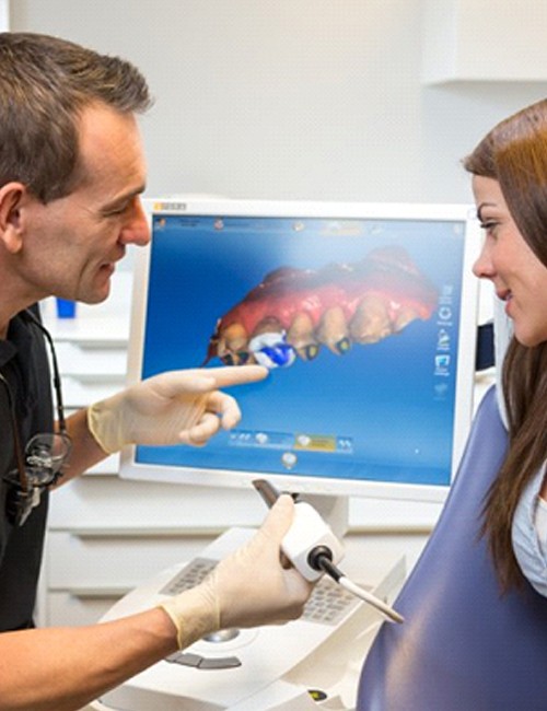 dentist in Copperas Cove showing a patient how their crown will look on a computer screen