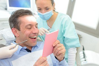 patient smiling during checkup