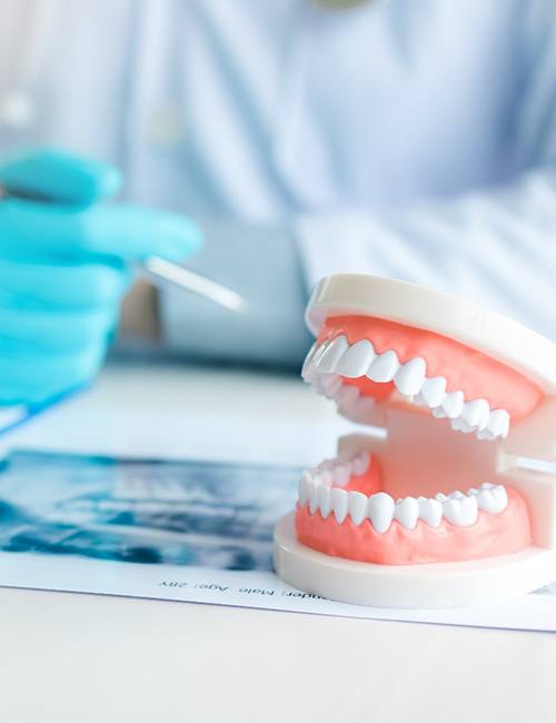 dentist explaining cost of dentures in Copperas Cove