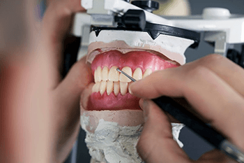 a technician working on creating dentures in Copperas Cove