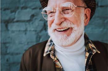 man smiling after getting dental implants in Coppers Cove