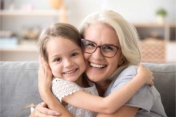 adult and child smiling together