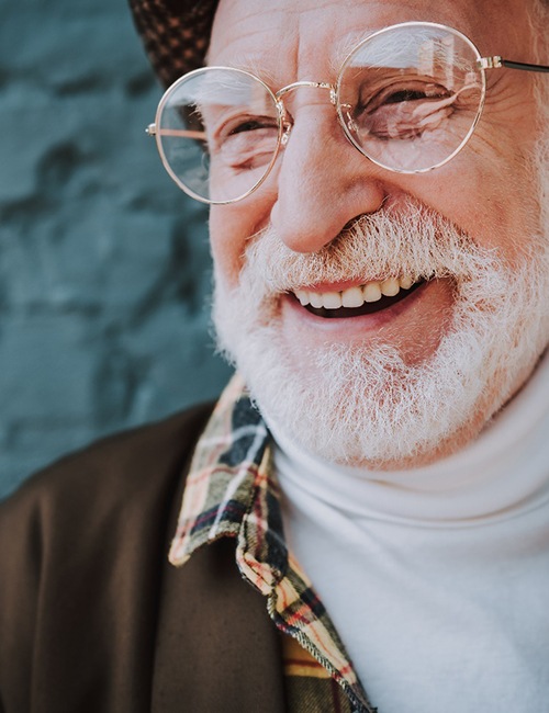  Senior man with glasses, beard, and implant dentures in Copperas Cove, TX