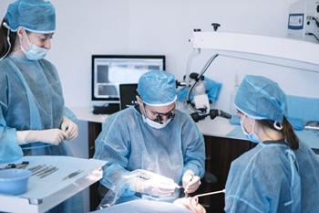 dentists performing dental implant surgery