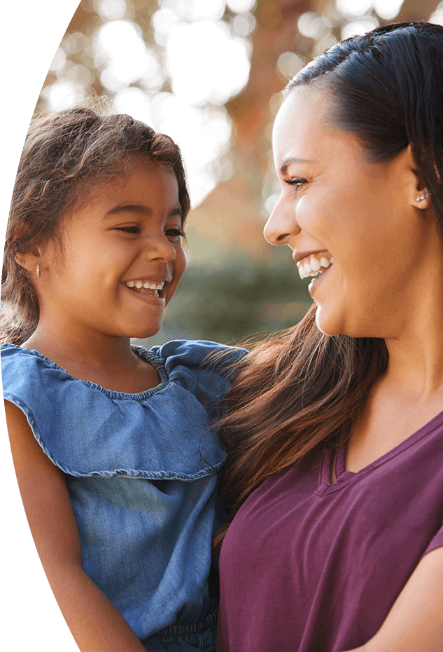 Mother and daughter smiling after family dentistry visit