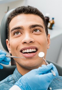 patient looking at dentist while smiling 