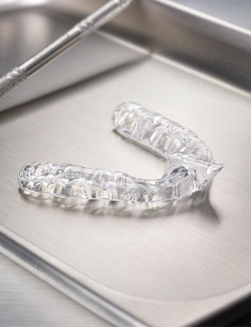 Clear nightguard for bruxism on metal tray