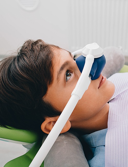 Patient with nitrous oxide dental sedation mask