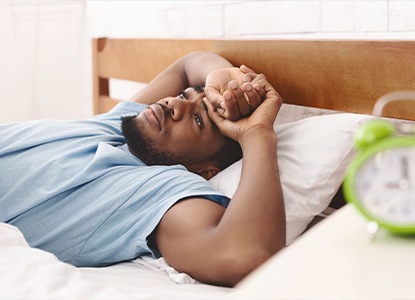 Man in need of sleep apnea therapy waking feeling tired