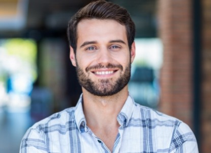 Man sharing flawless smile after cosmetic dentistry