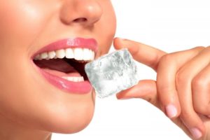 person chewing on ice cube 
