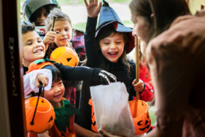 a group of children smiling during Halloween